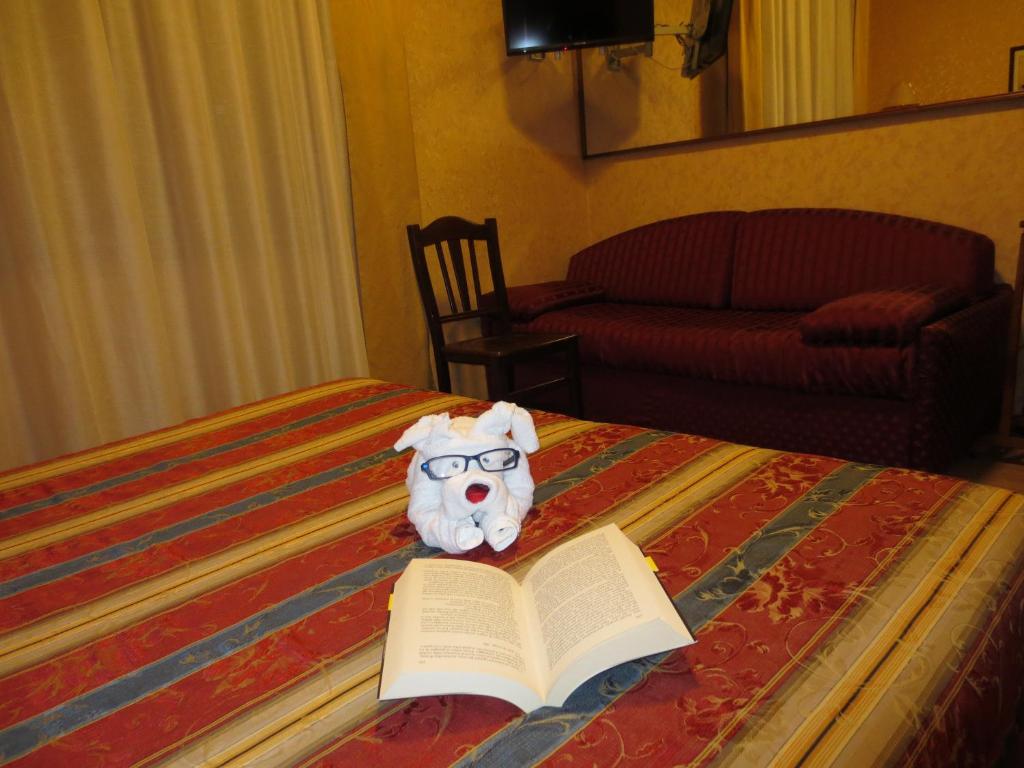 Postel nebo postele na pokoji v ubytování Hotel Italia City Center