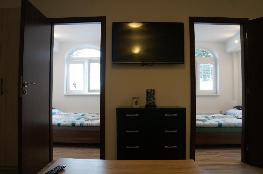 Postel nebo postele na pokoji v ubytování Penzion Kutil Trojanovice
