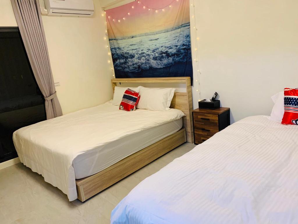Postel nebo postele na pokoji v ubytování Mei Jia Guesthouse