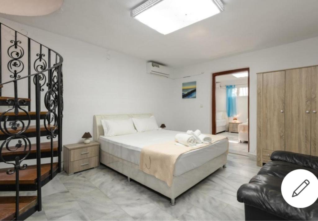 Postel nebo postele na pokoji v ubytování Sea Side Villa