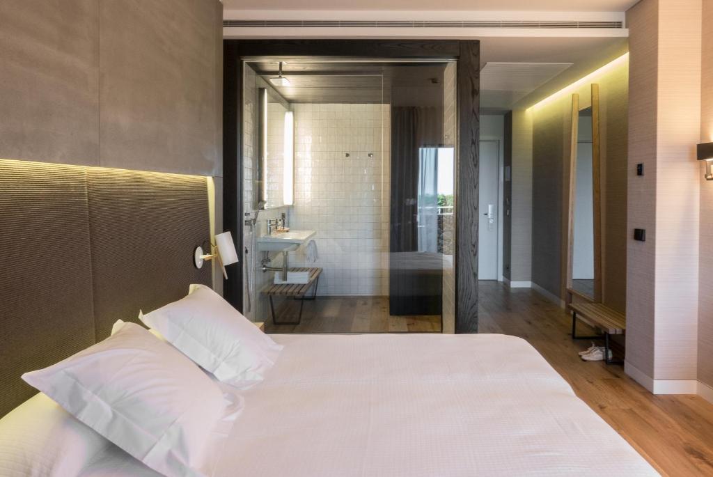 Postel nebo postele na pokoji v ubytování Hotel Can Xiquet
