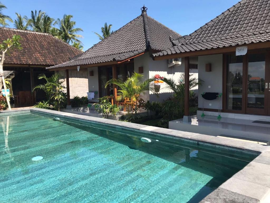 Bazén v ubytování Paraiso Cottage Ubud nebo v jeho okolí