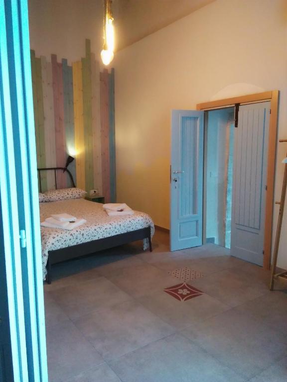 Postel nebo postele na pokoji v ubytování Lucernaio Rooms