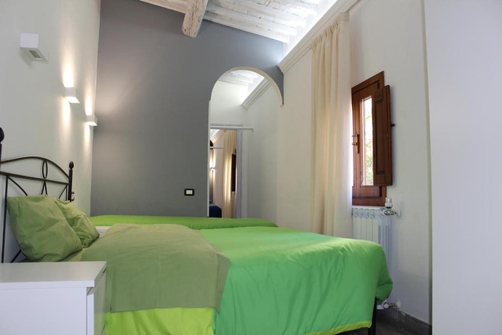 A bed or beds in a room at Gmax Guelfa Apartments