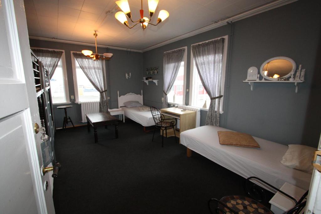 Postel nebo postele na pokoji v ubytování Dalvík Hostel Gimli