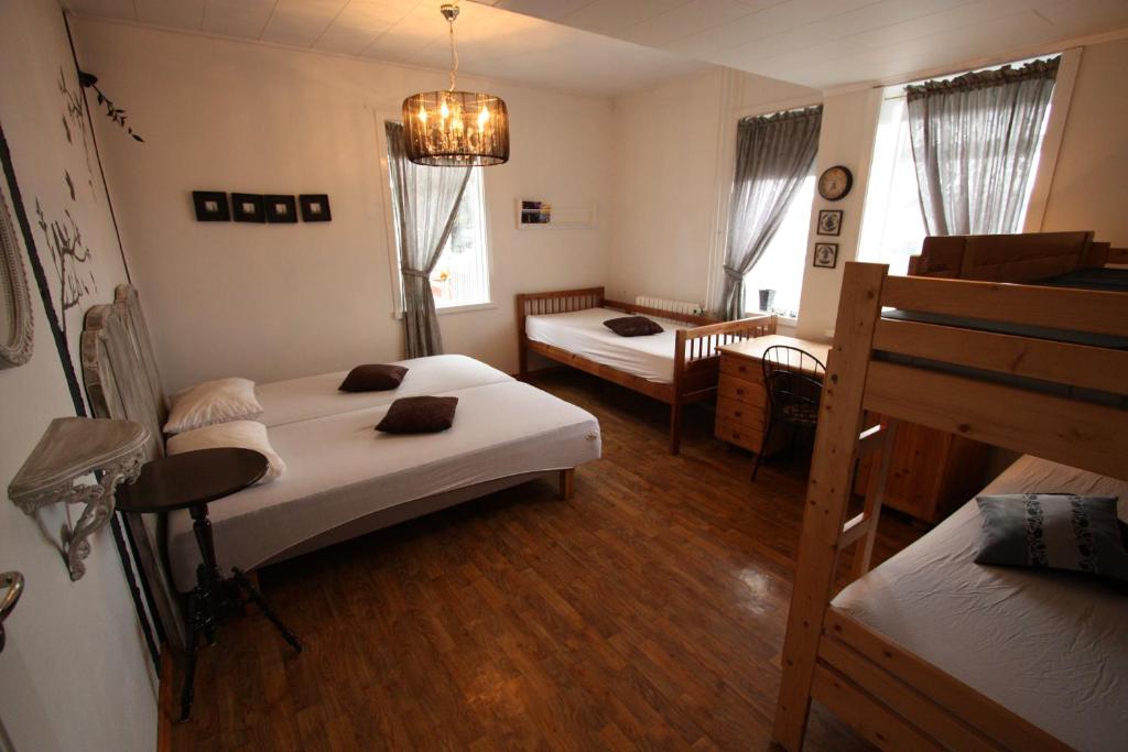 Postel nebo postele na pokoji v ubytování Dalvík Hostel Gimli