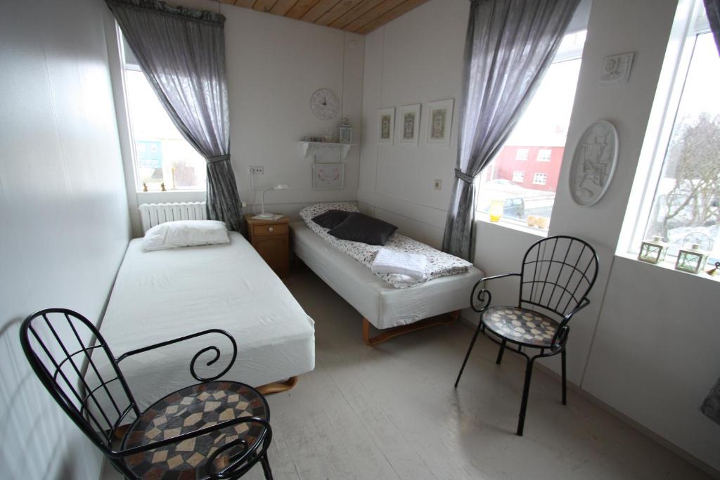 Postel nebo postele na pokoji v ubytování Dalvík Hostel Gimli