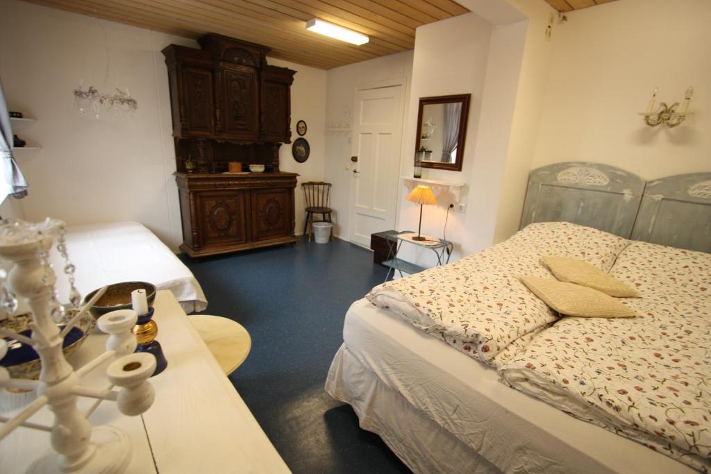 Postel nebo postele na pokoji v ubytování Dalvík Hostel Gimli