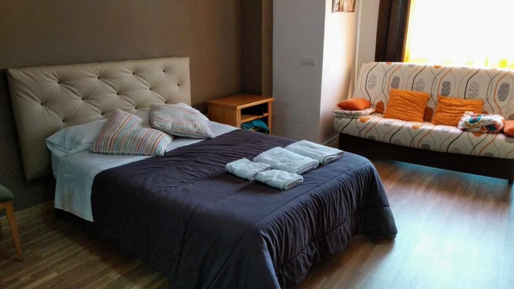 Łóżko lub łóżka w pokoju w obiekcie Apartamento Domingo Lozano