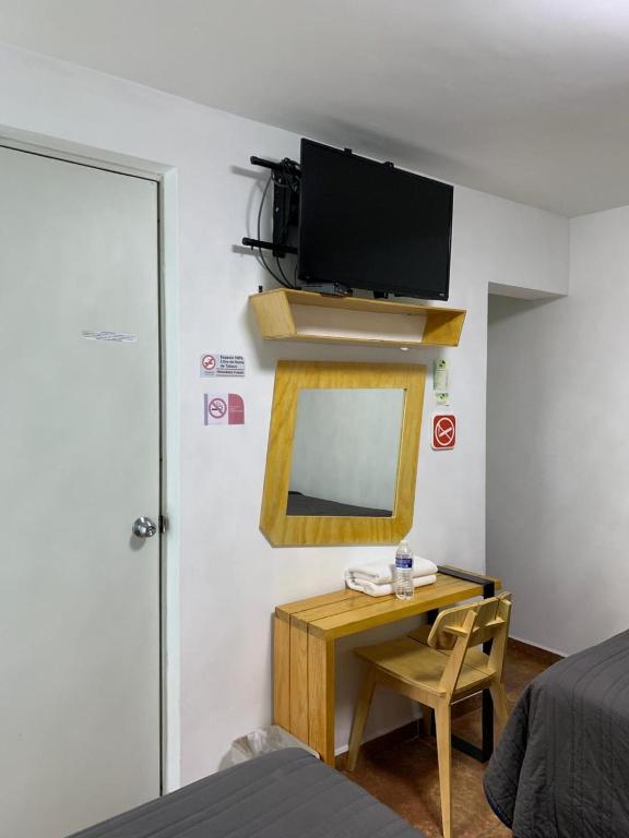 TV a/nebo společenská místnost v ubytování Hotel Tecnologico