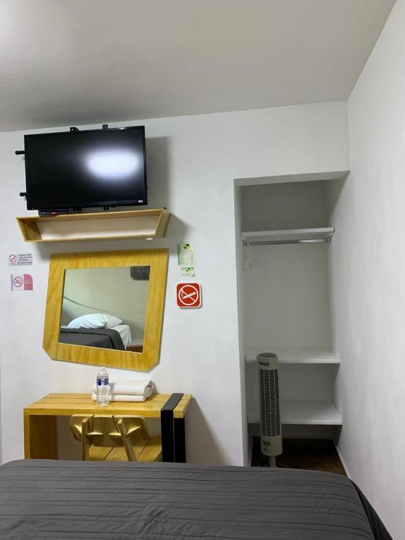 TV a/nebo společenská místnost v ubytování Hotel Tecnologico