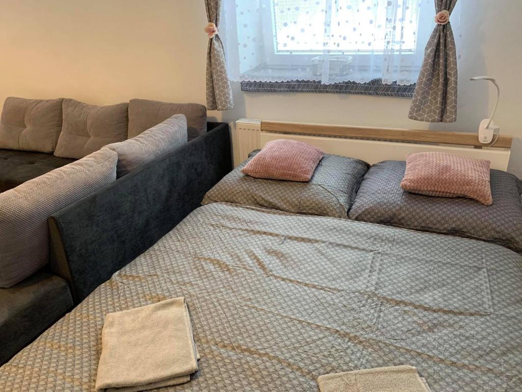 Postel nebo postele na pokoji v ubytování Apartmán Filipovice s letní terasou