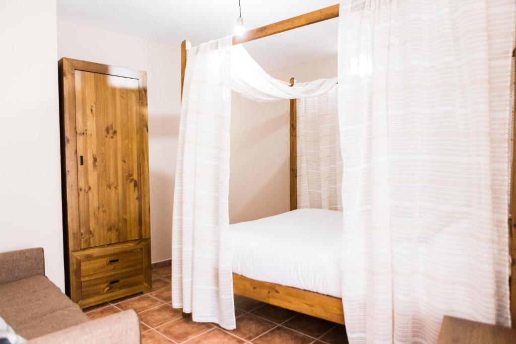 Postel nebo postele na pokoji v ubytování Casa Rural Tio Mora