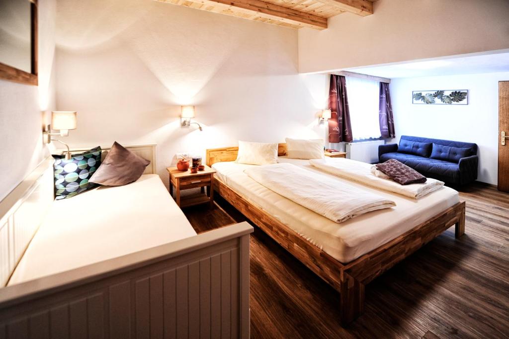 Postel nebo postele na pokoji v ubytování Appartements & Chalets Wiesenruh