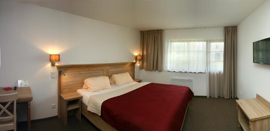 Postel nebo postele na pokoji v ubytování Hotel Resort Stein
