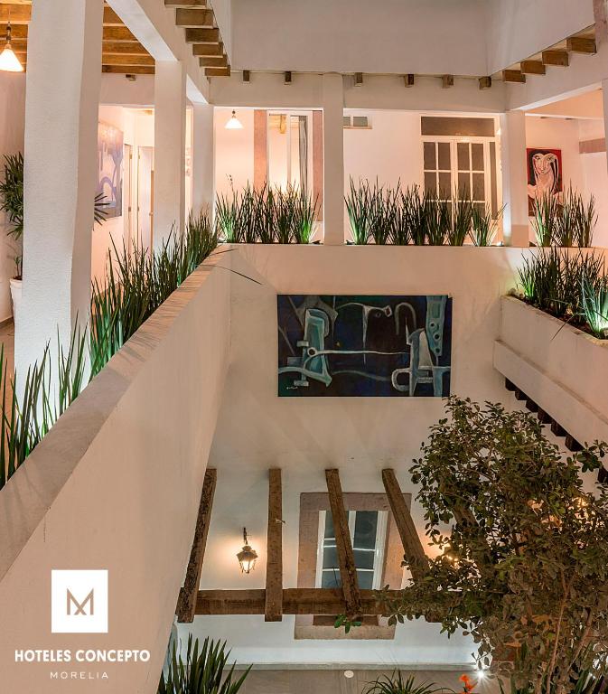 TV a/nebo společenská místnost v ubytování M Hoteles Concepto