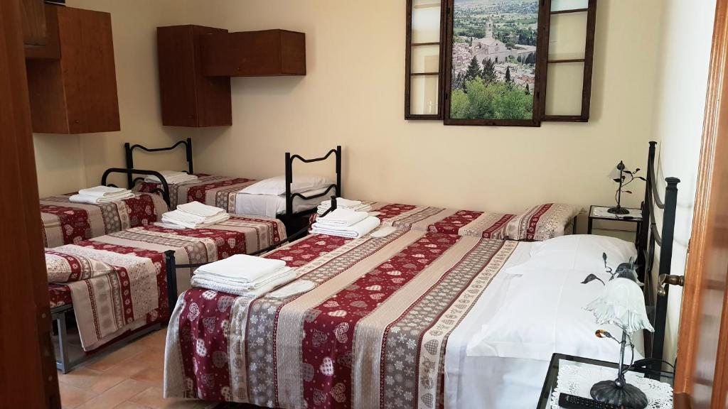Posteľ alebo postele v izbe v ubytovaní Casa Maria