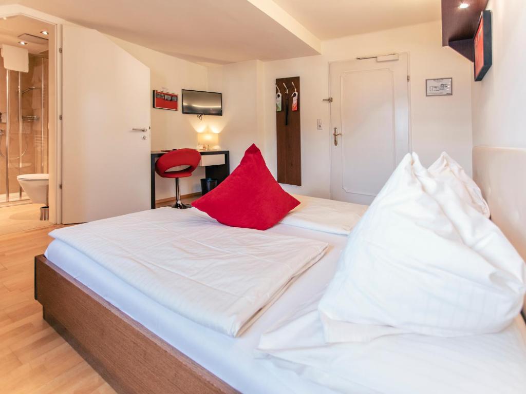 Postel nebo postele na pokoji v ubytování Hotel Rosenvilla