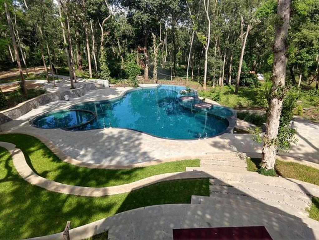 Bazén v ubytování The Birchwood Retreat, Madikeri nebo v jeho okolí
