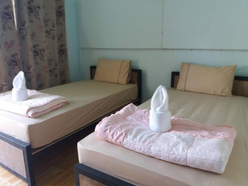Postel nebo postele na pokoji v ubytování P.L.P Guesthouse - Mae Hong Son