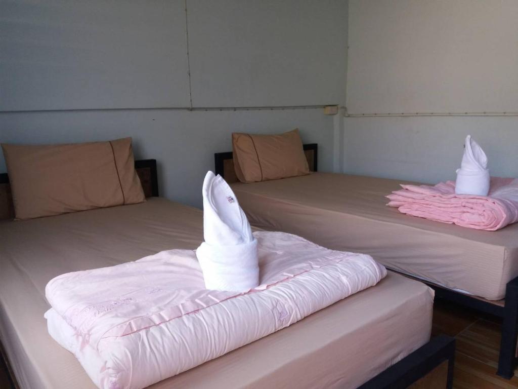 Postel nebo postele na pokoji v ubytování P.L.P Guesthouse - Mae Hong Son