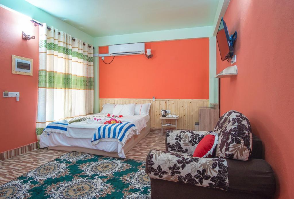 Postel nebo postele na pokoji v ubytování Olhumathi View Inn