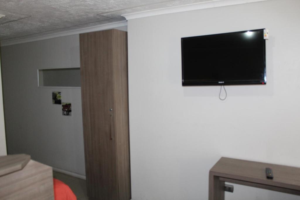TV a/nebo společenská místnost v ubytování Hostal Quinta Normal