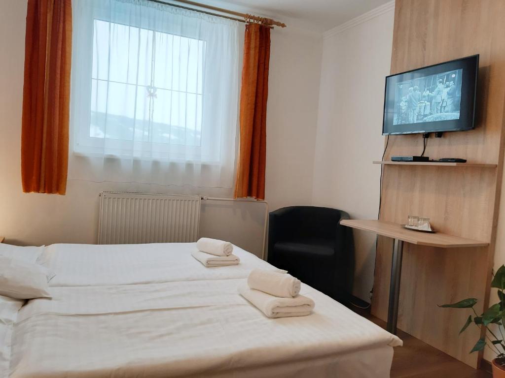 Voodi või voodid majutusasutuse Penzión Lúčky toas