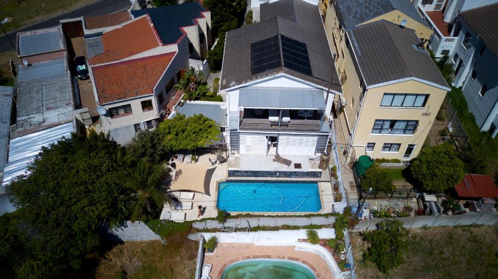 an aerial view of a house with a swimming pool at Upperbloem Guesthouse and Apartments in Cape Town