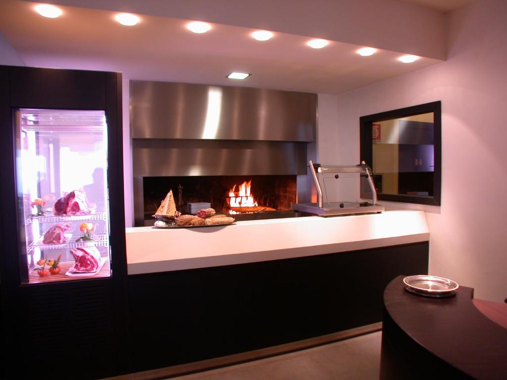Kuchyň nebo kuchyňský kout v ubytování Hotel La Torretta