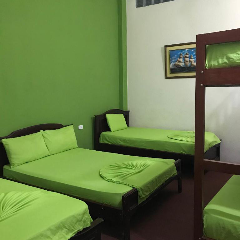 Postel nebo postele na pokoji v ubytování Hostal Puerto Azul