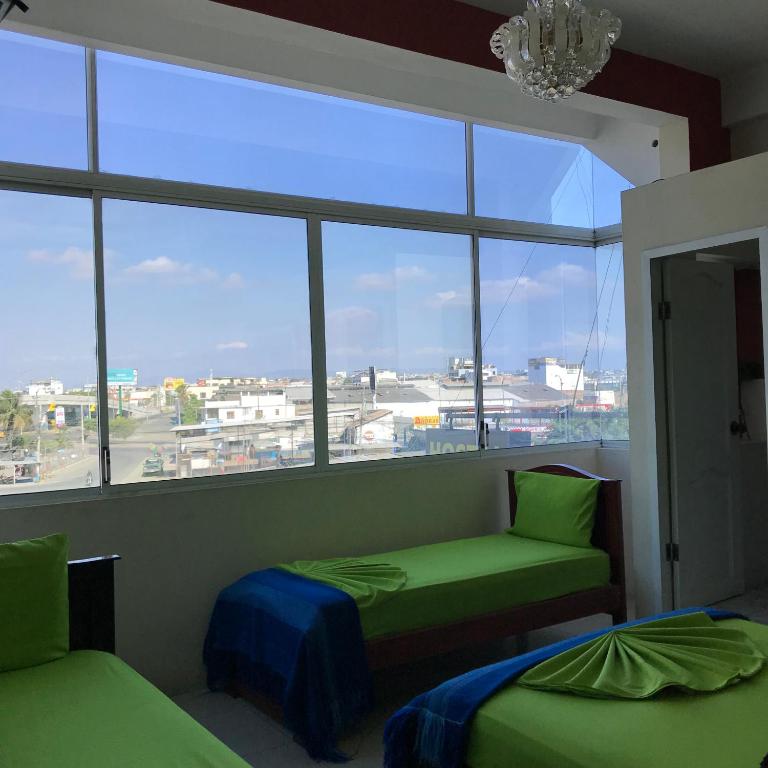 Postel nebo postele na pokoji v ubytování Hostal Puerto Azul