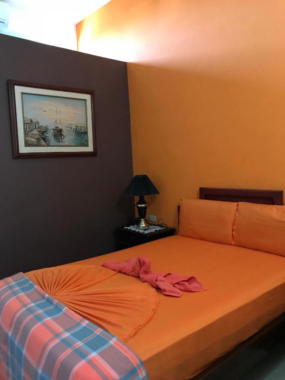 Postel nebo postele na pokoji v ubytování Hostal Puerto Azul