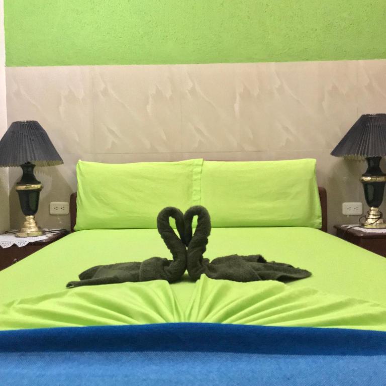Postel nebo postele na pokoji v ubytování Hostal Puerto Azul
