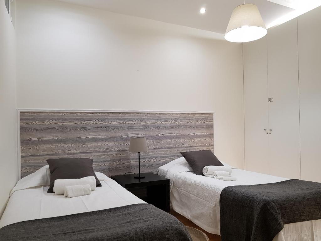 Postel nebo postele na pokoji v ubytování Downtown Apartments Bica
