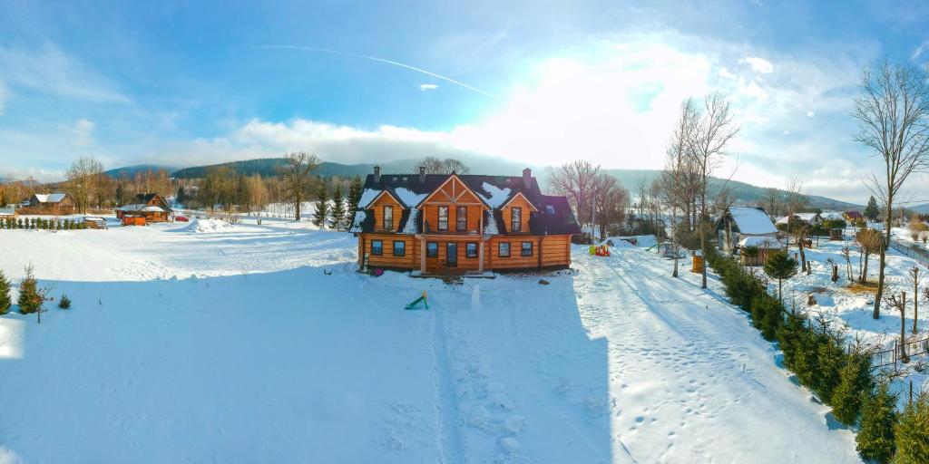 an aerial view of a house in the snow at Agroturystyka Trzy Siostry in Stronie Śląskie