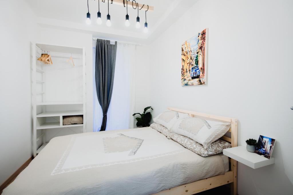 A bed or beds in a room at La Boutique del Vento - Esclusivo in pieno centro