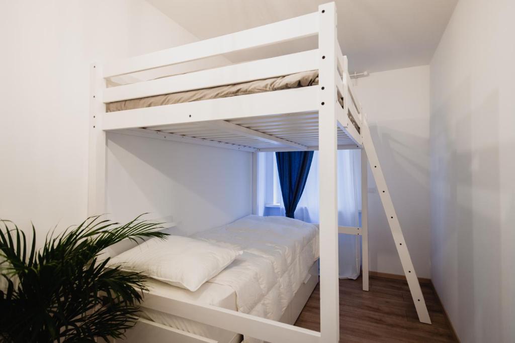 A bed or beds in a room at La Boutique del Vento - Esclusivo in pieno centro