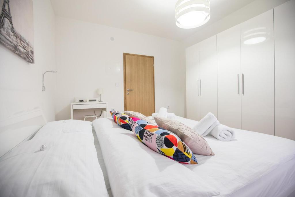 Posteľ alebo postele v izbe v ubytovaní Friday Apartments