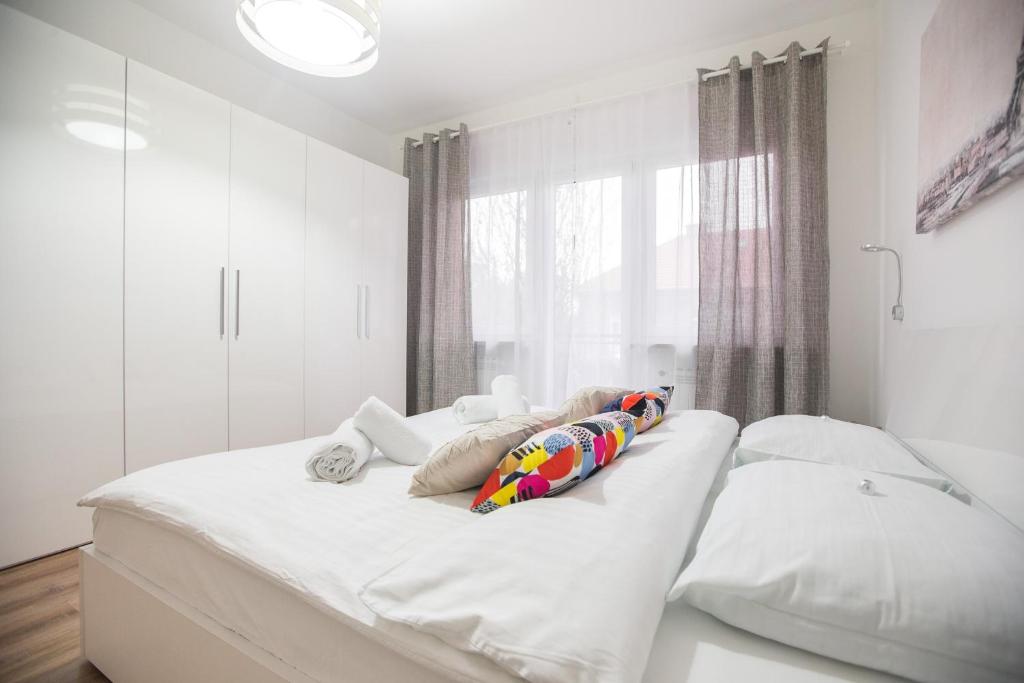 Posteľ alebo postele v izbe v ubytovaní Friday Apartments