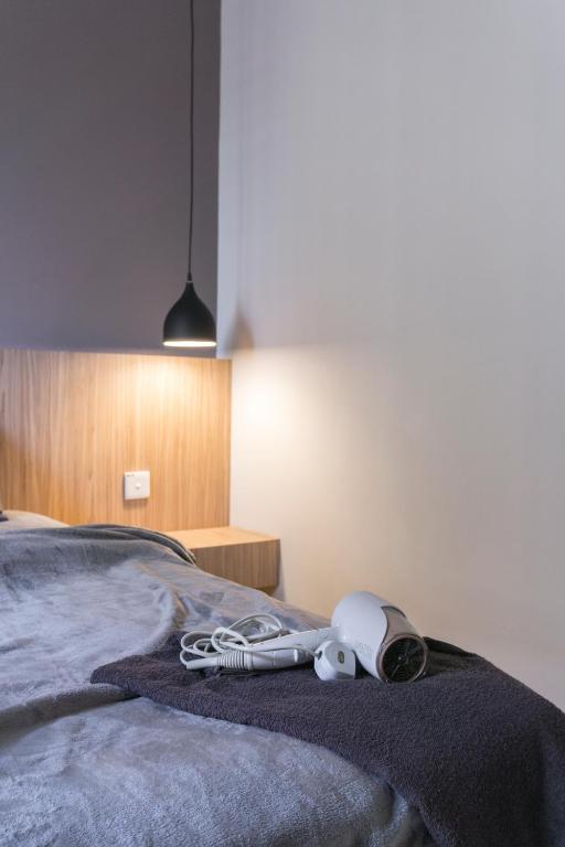 Postel nebo postele na pokoji v ubytování Arc1901 staycation