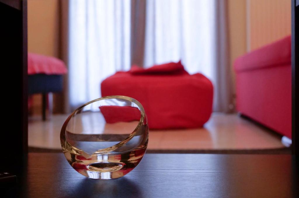 a glass bowl sitting on top of a table at Erofili Apartment in Thessaloniki