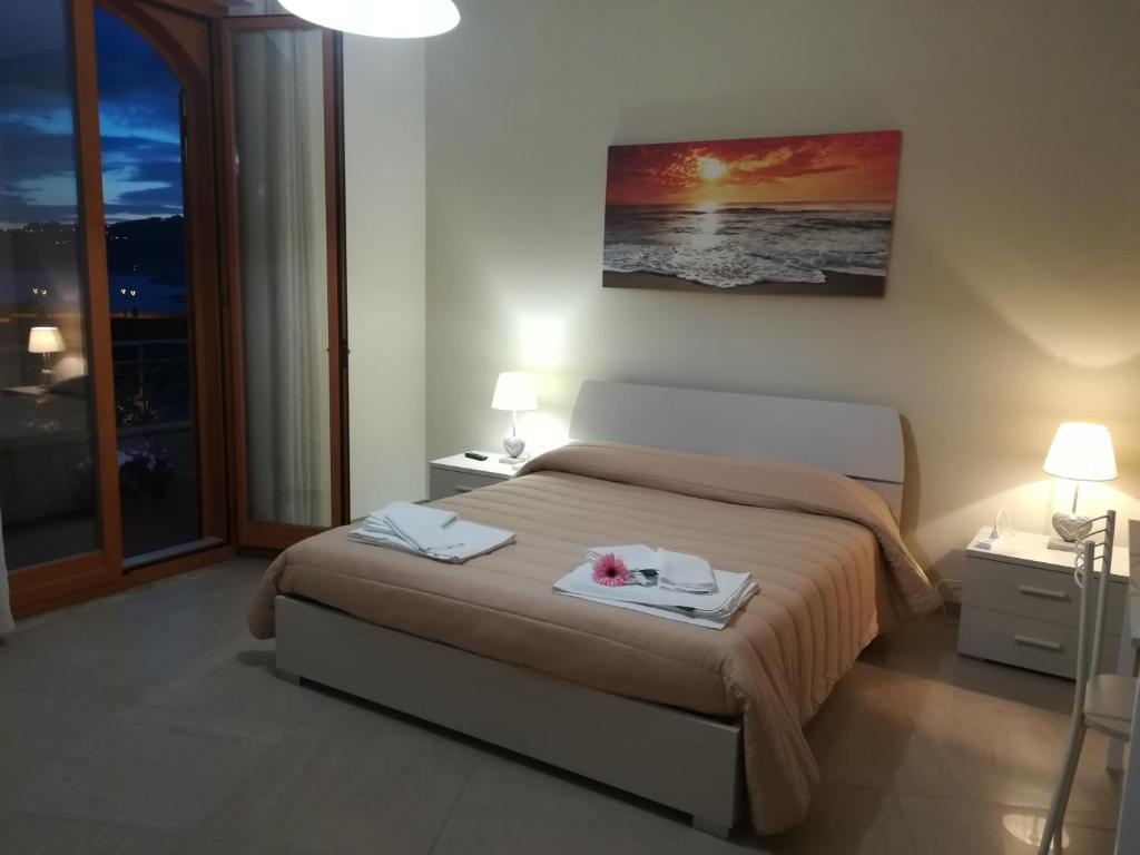 Postel nebo postele na pokoji v ubytování B&B la spiaggetta di Stazzo