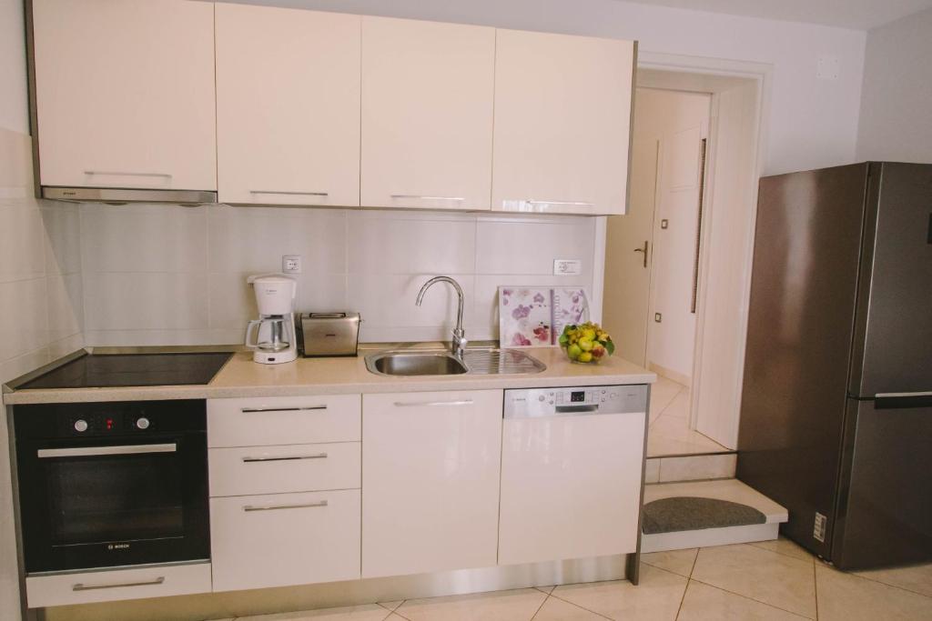 Kuchyň nebo kuchyňský kout v ubytování Apartments Jasna