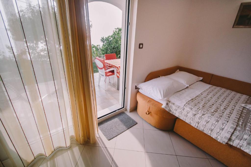 Postel nebo postele na pokoji v ubytování Apartments Jasna