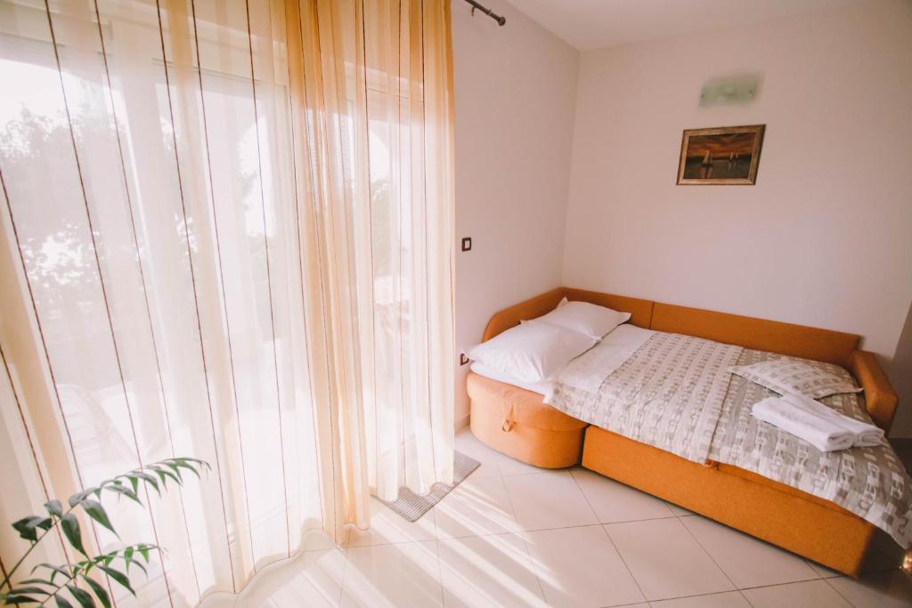 Postel nebo postele na pokoji v ubytování Apartments Jasna