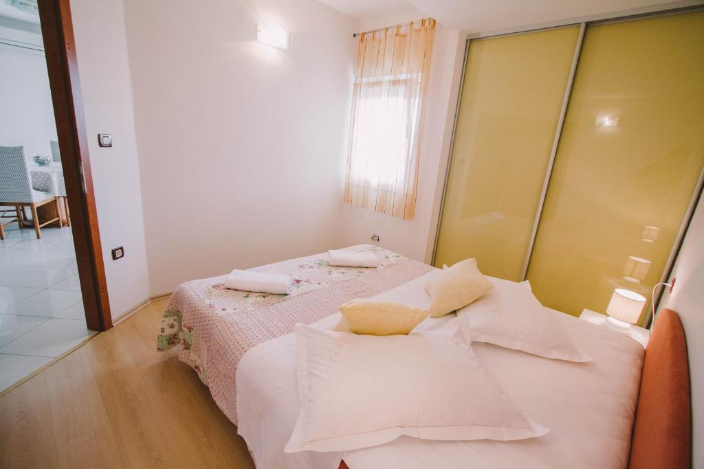Postel nebo postele na pokoji v ubytování Apartments Jasna