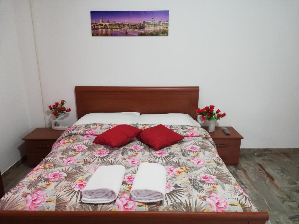 a bedroom with a bed with two pillows on it at Venice Holiday in Marghera