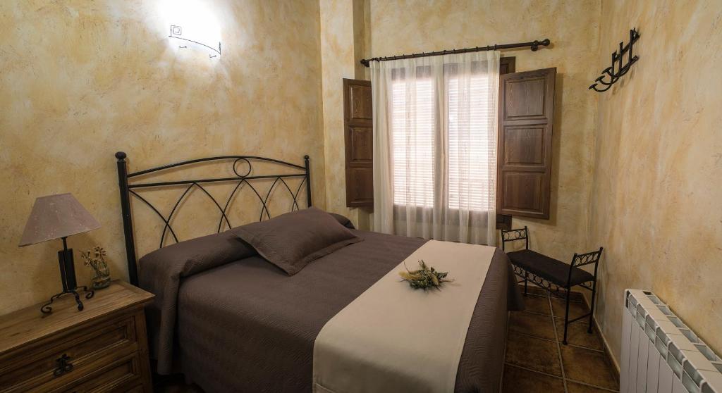 Postel nebo postele na pokoji v ubytování Cases Rurals El Castell