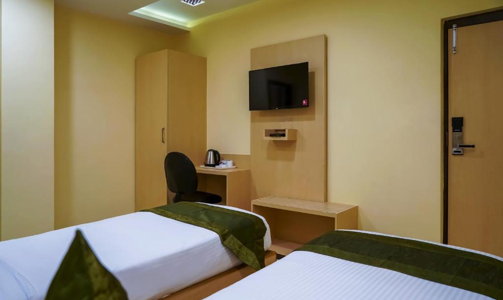 TV a/nebo společenská místnost v ubytování Treebo Oasis, Laxmisagar